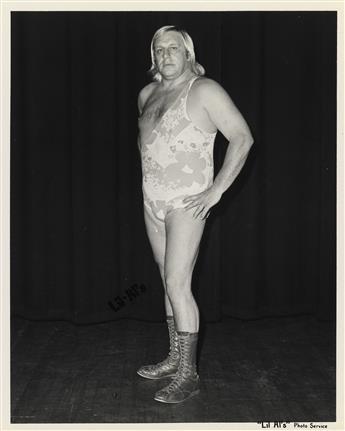 (PRO WRESTLING) Archive with 100 photographs of vibrant and scantily clad wrestlers striking a pose.